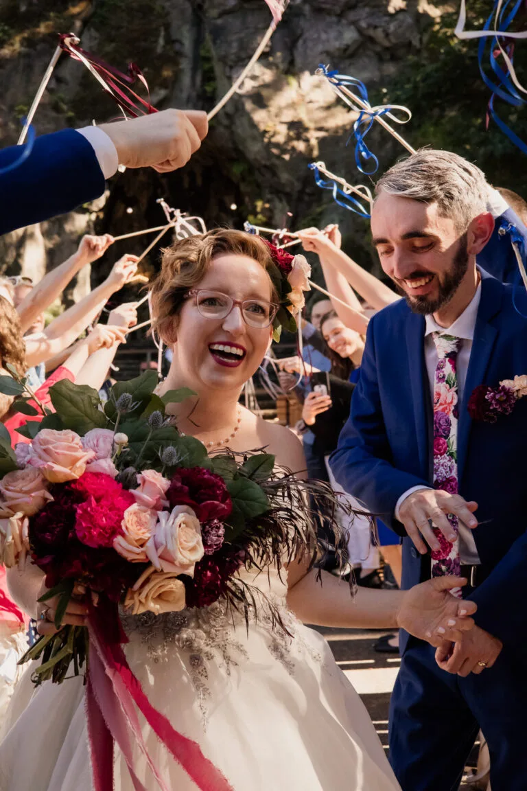 Racheal and Corbin celebrating their outdoor wedding