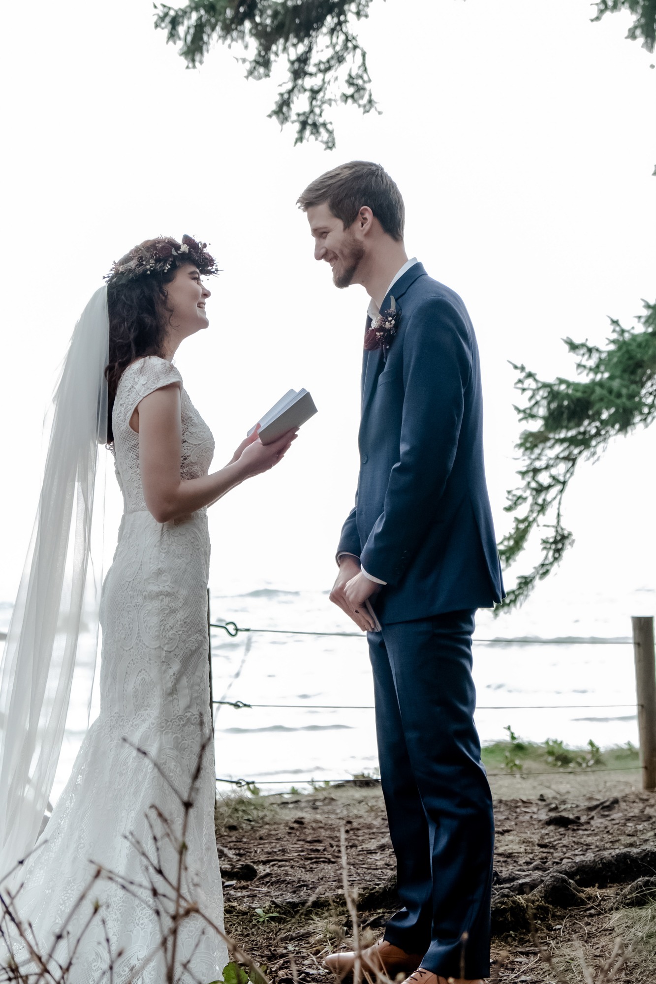 Couple exchanging vows by the ocean