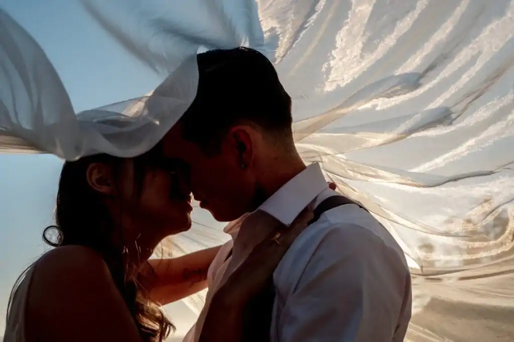 PATRICIA & JACOB kissing under the veil