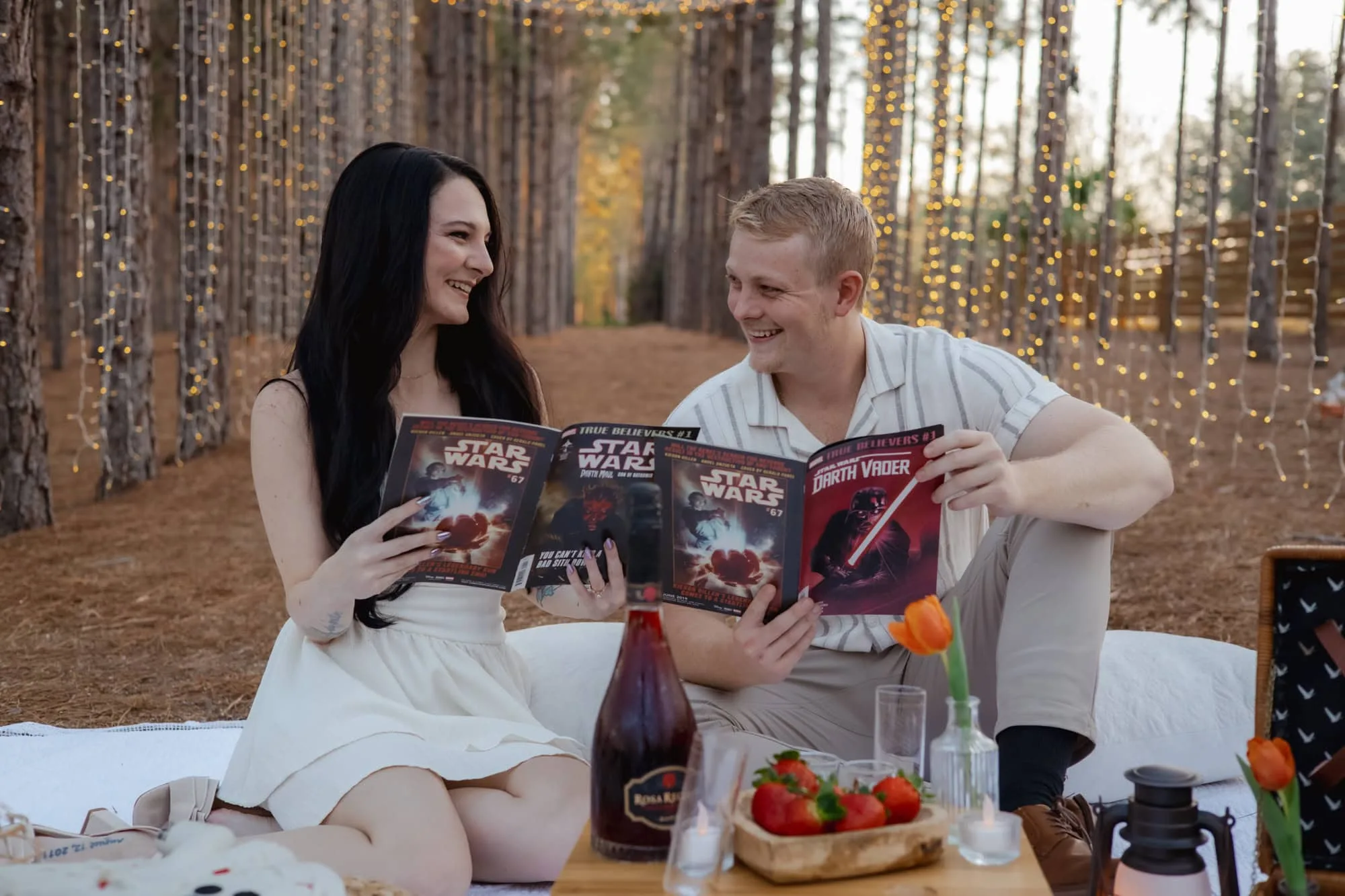 a couple smiling at each other holding a Star Wars magazine at The pinery events in Orlando