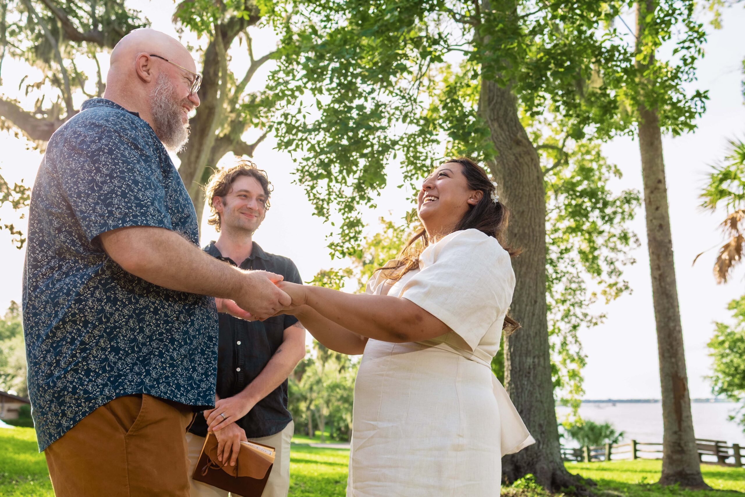 couple laugh in their ceremony at philippe park